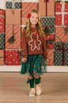 Green Gingerbread Tutu Skirt Set - 6-12 Months - Brown long-sleeve top with a gingerbread man graphic paired with a green tulle tutu skirt decorated with gold stars.