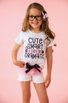 "Cute, Smart & A Tiny Bit Dramatic" Denim Short Set - Small-3T - White short-sleeve shirt with black text and pink denim shorts featuring a black bow and frayed hems.