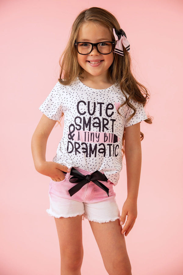 "Cute, Smart & A Tiny Bit Dramatic" Denim Short Set - Small-3T - White short-sleeve shirt with black text and pink denim shorts featuring a black bow and frayed hems.