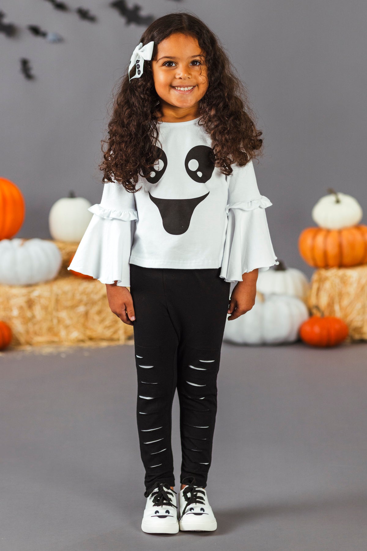 Black & White Ghost Distressed Legging Set - 3XS-6-12 Months - Toddler black leggings with white distressed slashes paired with a white long-sleeve top featuring a ghost face and ruffled.