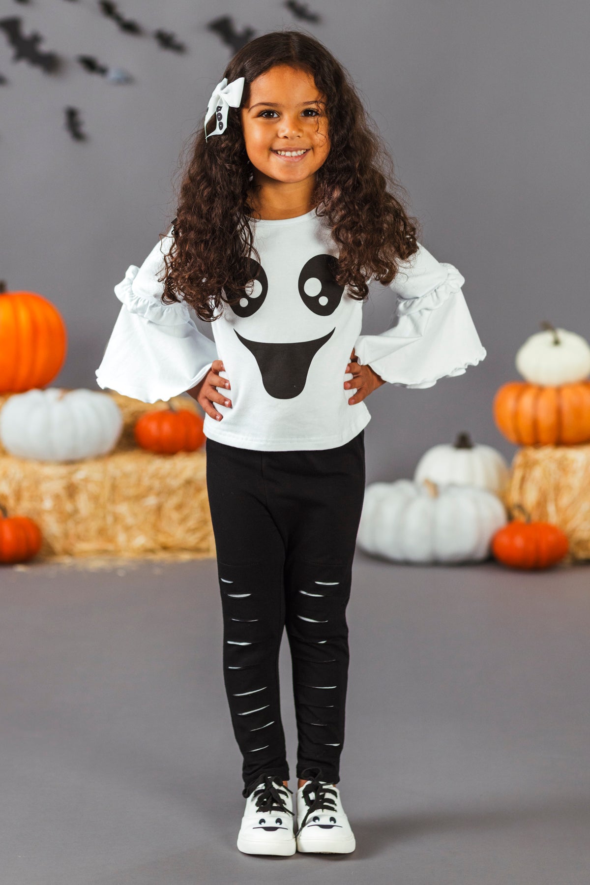 Black & White Ghost Distressed Legging Set - 3XS-6-12 Months - Girl wearing black leggings with distressed details and a white long-sleeve top featuring a large black ghost face design.
