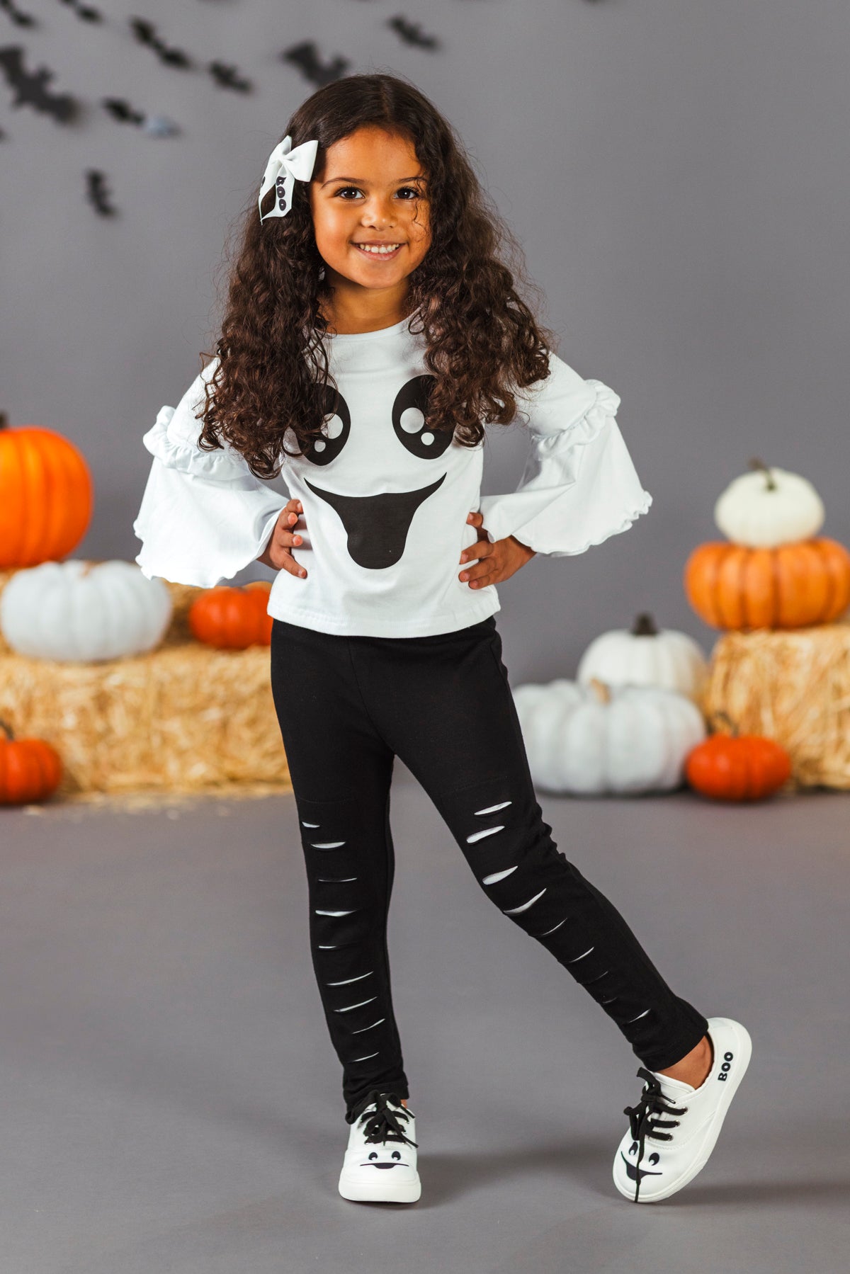 Black & White Ghost Distressed Legging Set - 3XS-6-12 Months - White long-sleeve top with black ghost graphic and ruffled sleeves paired with black leggings featuring distressed slits.