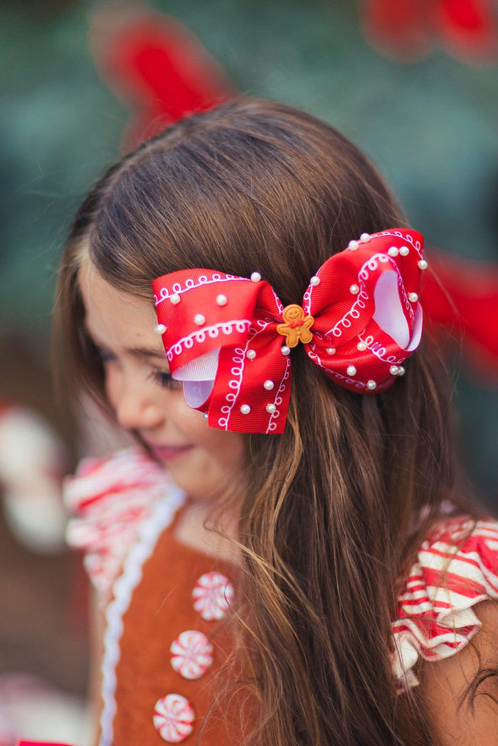Gingerbread Pearl Bow - Default Title - Red satin bow hair clip with white pearl accents and a gingerbread man center detail.