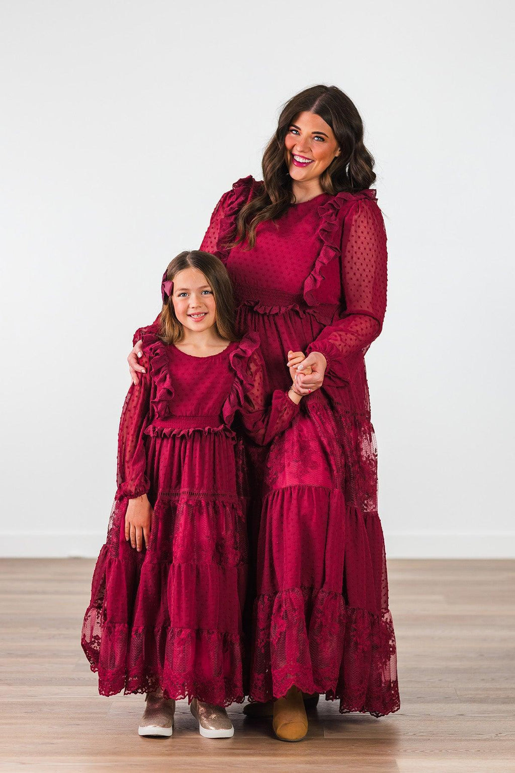 Mom & Me - Burgundy Swiss Dot Dress - CHILD-Small-3T - Burgundy long-sleeve maxi dresses with Swiss dot texture and ruffle details on woman and girl.