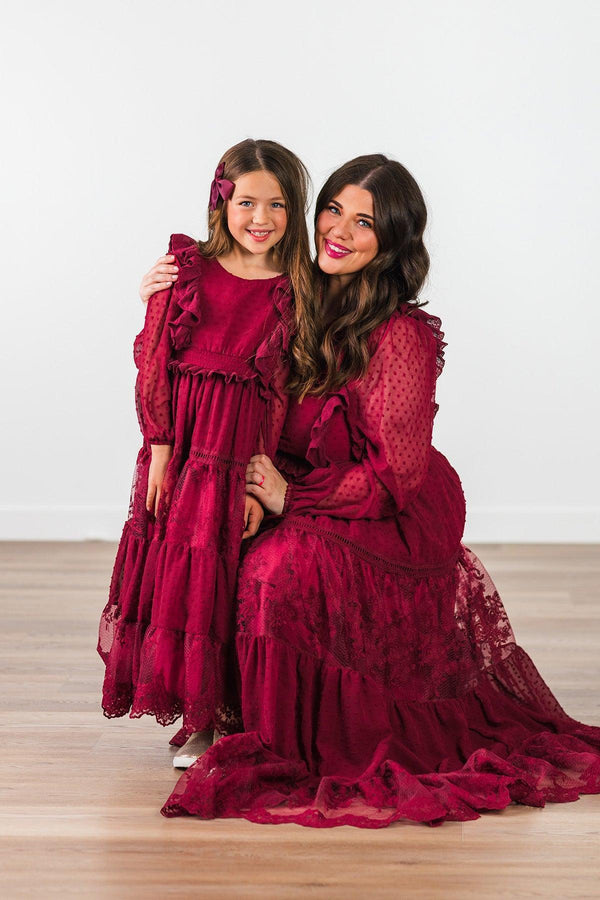 Mom & Me - Burgundy Swiss Dot Dress - CHILD-Small-3T - Burgundy Swiss dot dress with ruffled sleeves and tiered skirt, worn by woman and girl.