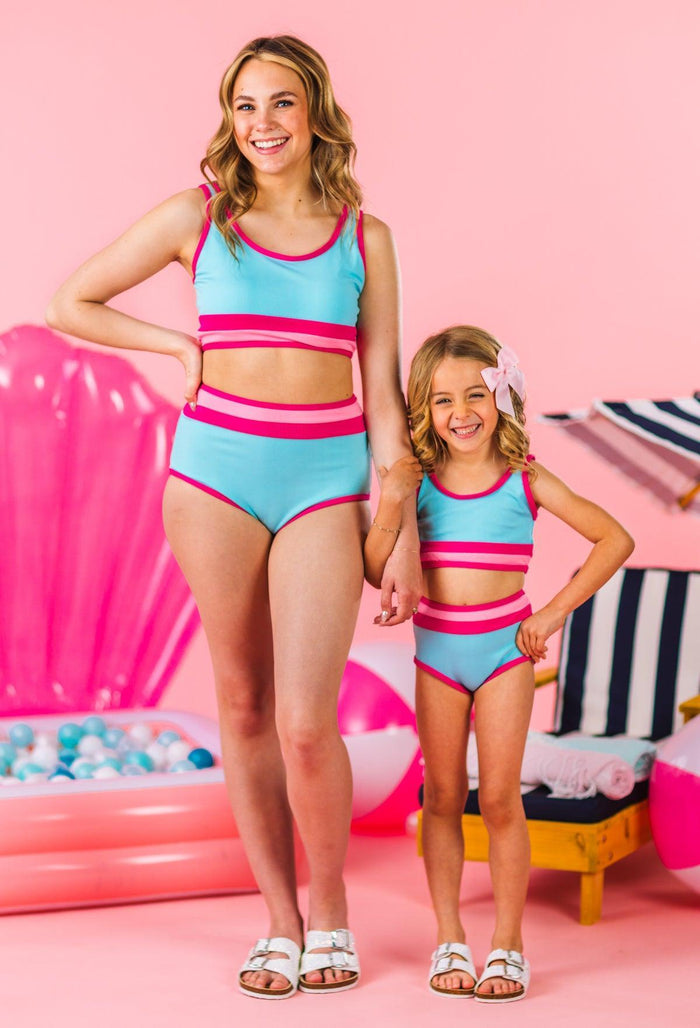 Mom & Me - Blue & Pink Stripe Bikini - CHILD-3XS-6-12 Months - Matching blue and pink striped tank bikinis with high-waisted bottoms for mom and daughter against a pink backdrop.
