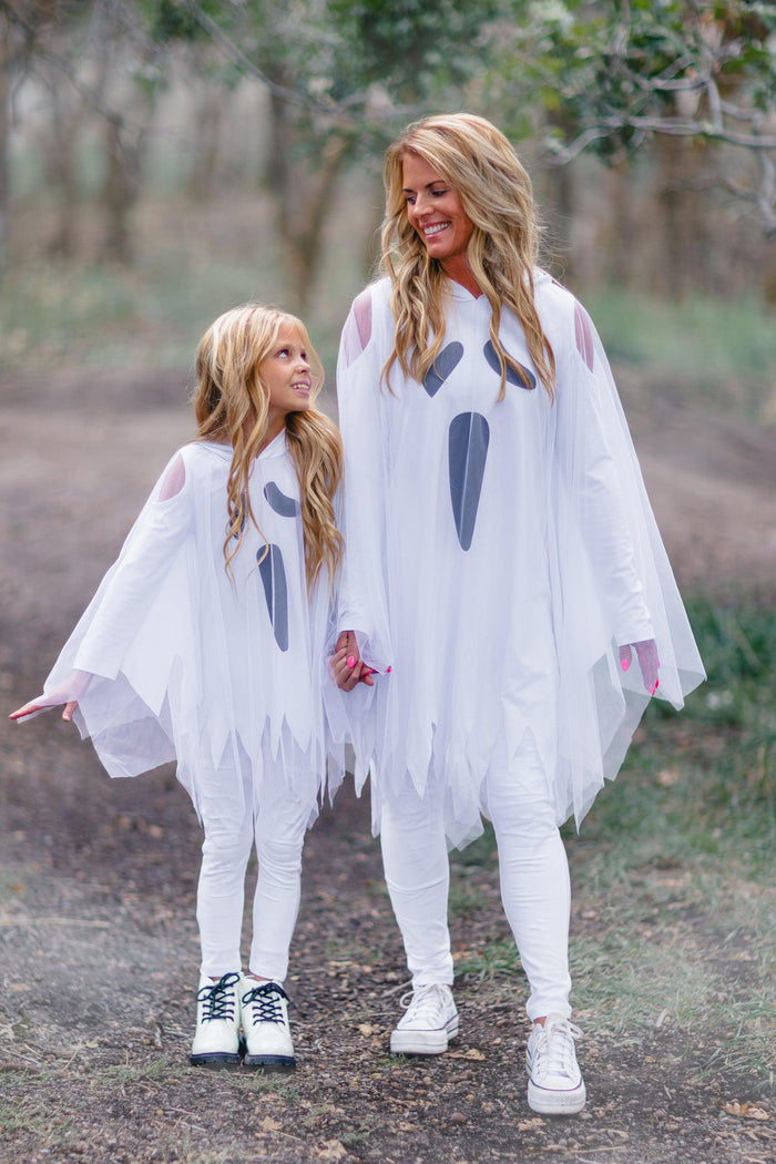 Mom & Me - White Ghost Costume Set - CHILD-3XS-6-12 Months - Matching white ghost costumes with jagged hems and black face details, worn by woman and child outdoors.