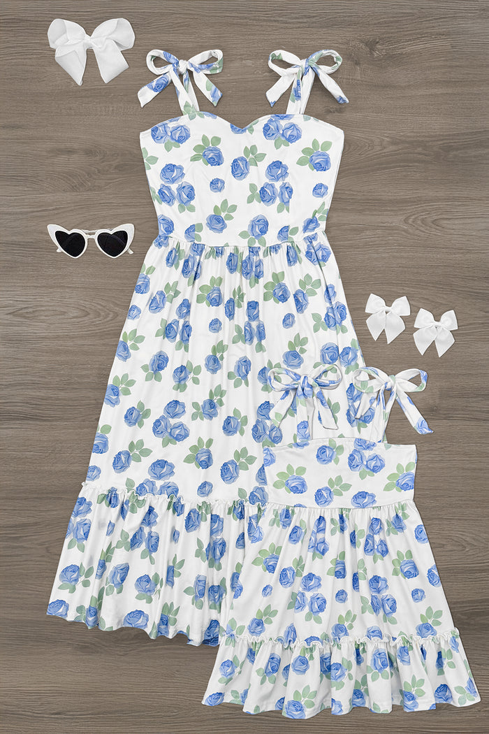 Mom & Me - Blue Rose Dress - CHILD-6-12 Months - Blue and white floral sleeveless dresses with shoulder ties, one adult-sized and one child-sized, paired with white bows and .