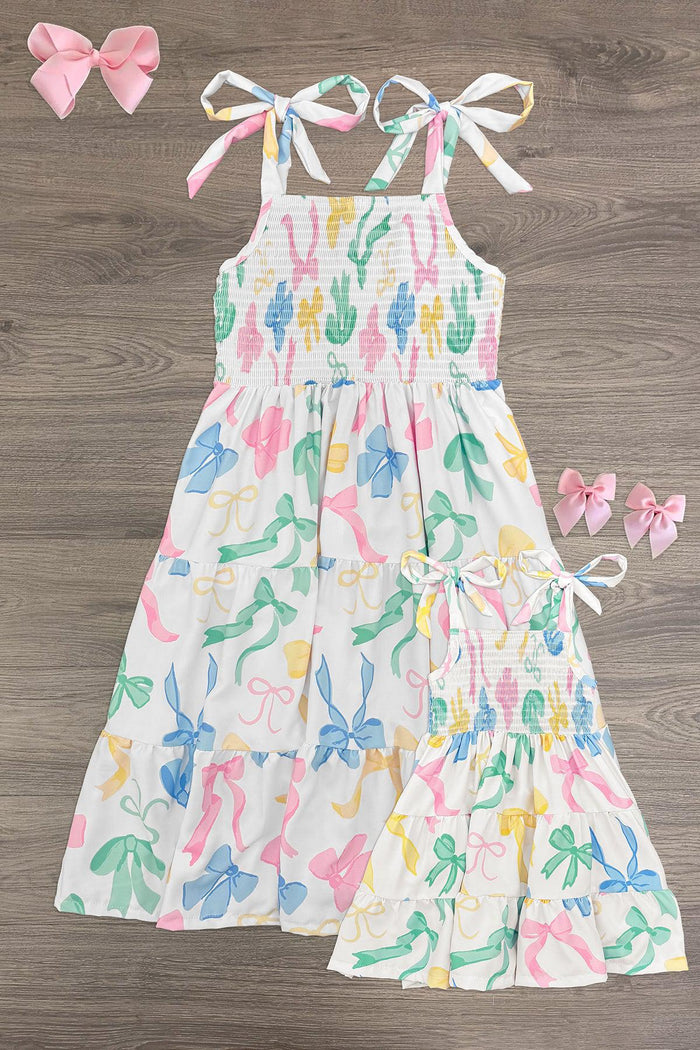 Mom & Me - Pastel Bows Ruffle Dress - BABY-Newborn - White smocked dress with pastel rainbow bow print and ruffle hem, matching smaller dress included.