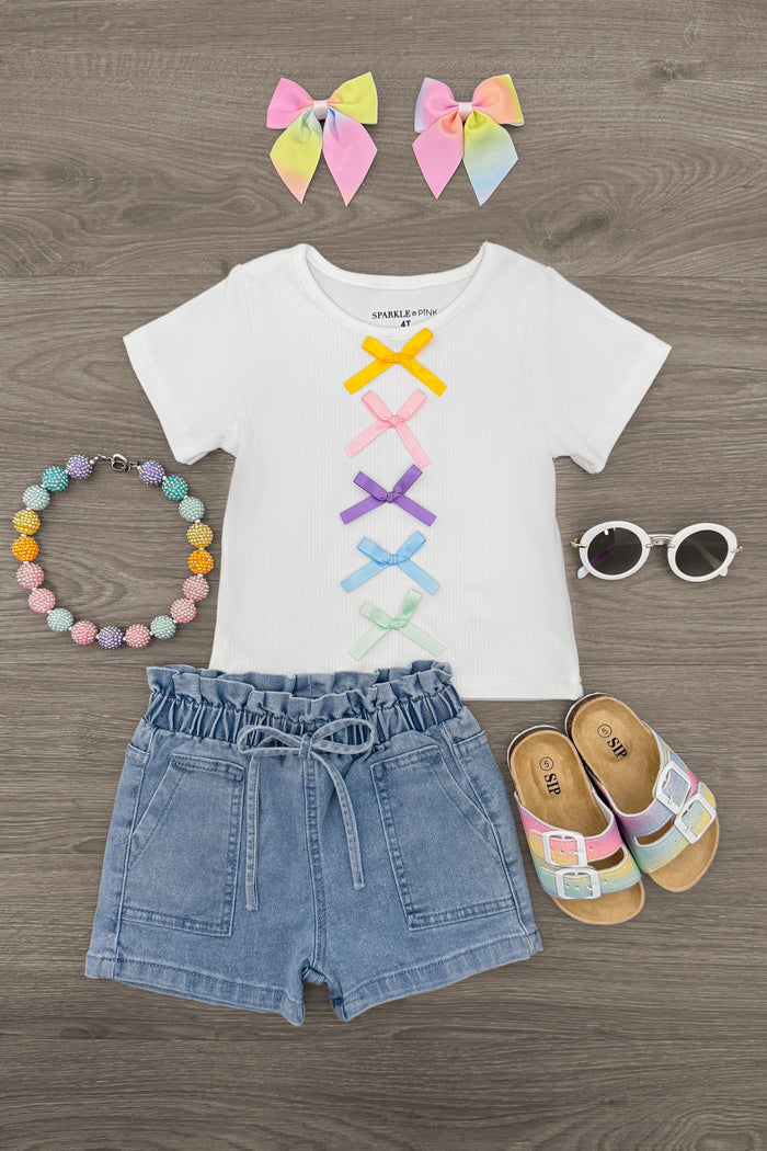 Pastel Bow Denim Short Set - 6-12 Months - White short-sleeve shirt with pastel bow design paired with light blue denim shorts and matching pastel bow hair clips.