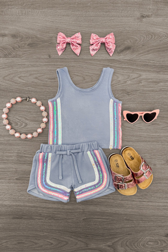 Blue Sequin Short Set - 6-12 Months - Blue sequin tank top and shorts set with rainbow stripes, paired with pink bow clips and heart-shaped sunglasses.