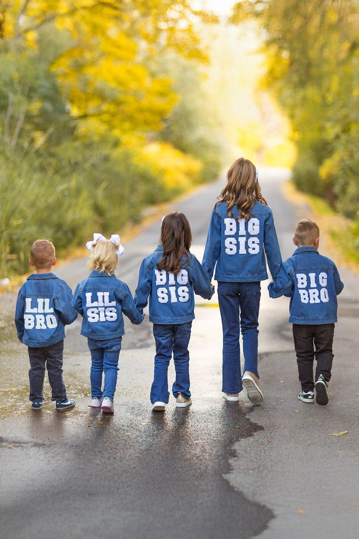 "Big Sis, Lil Sis, Big Bro, Lil Bro" Denim Jacket - Big Sis / GIRL-3XS-6-12 Months-FAMILY - Five children walking down a tree-lined road wearing blue denim jackets with "Big Sis" and "Lil Sis" or "Big Bro" and "Lil.