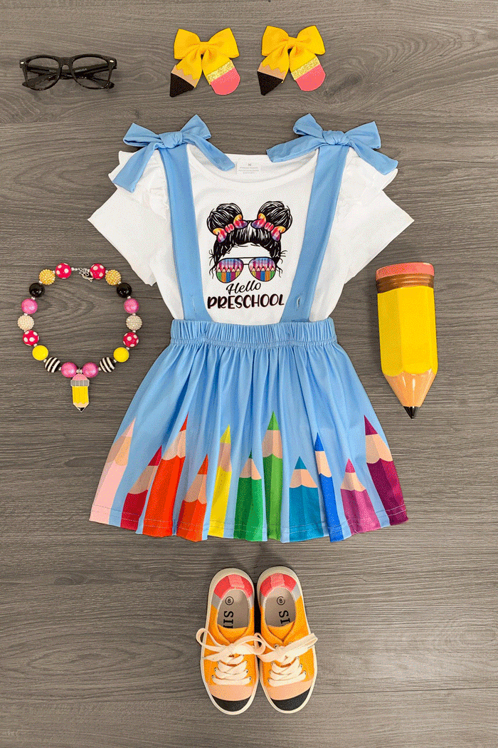 "Hello Preschool - 4th Grade" Rainbow Pencil Suspender Skirt Set - PRESCHOOL / 3XS-6-12 Months - White short-sleeve top with "Preschool" graphic and blue bow straps, rainbow pencil print blue suspender skirt, matching.