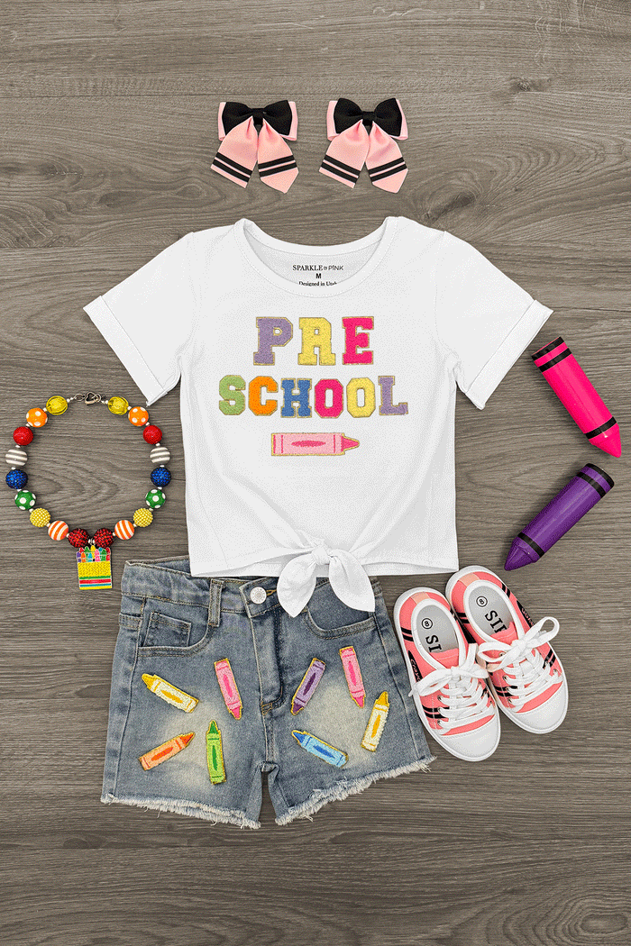 "Pre School - Sixth Grade" Crayon Denim Short Set - PRE-K / 2T - White short-sleeve tee with colorful "PRE SCHOOL" text tied at waist, denim shorts with crayon patches, white sneakers, pink .
