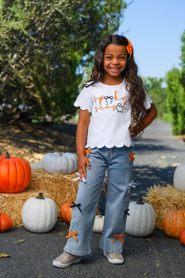 "Spooky Season" Bow Denim Pant Set - 6-12 Months - White short-sleeve ruffle-hem top with Halloween print and light blue denim pants featuring orange bows on the legs.