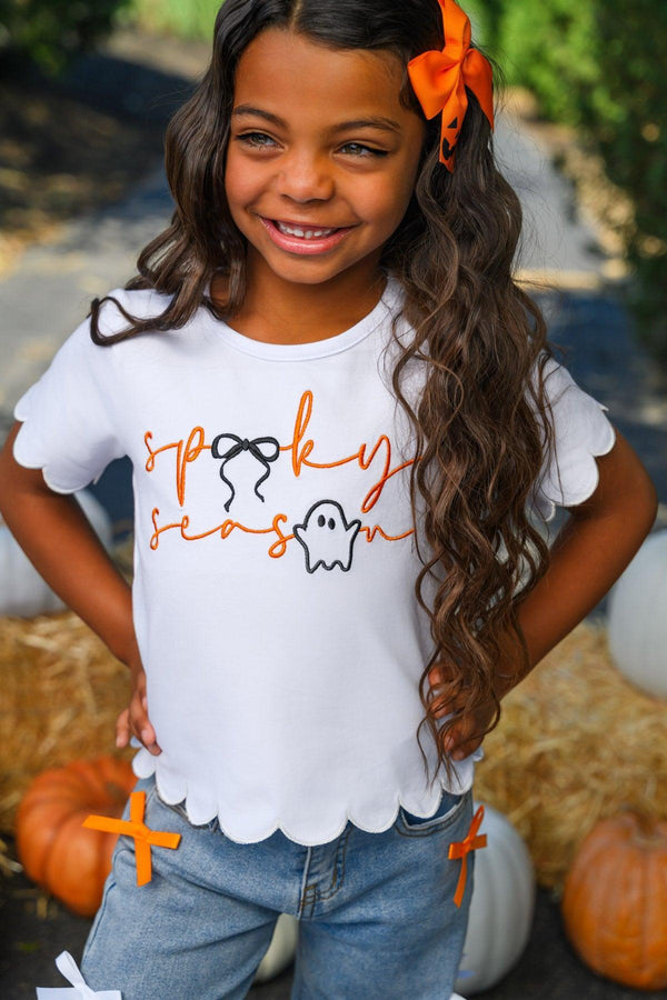 "Spooky Season" Bow Denim Pant Set - 6-12 Months - White short-sleeve shirt with scalloped hem and orange "spooky season" text with ghost graphic, paired with blue denim pants