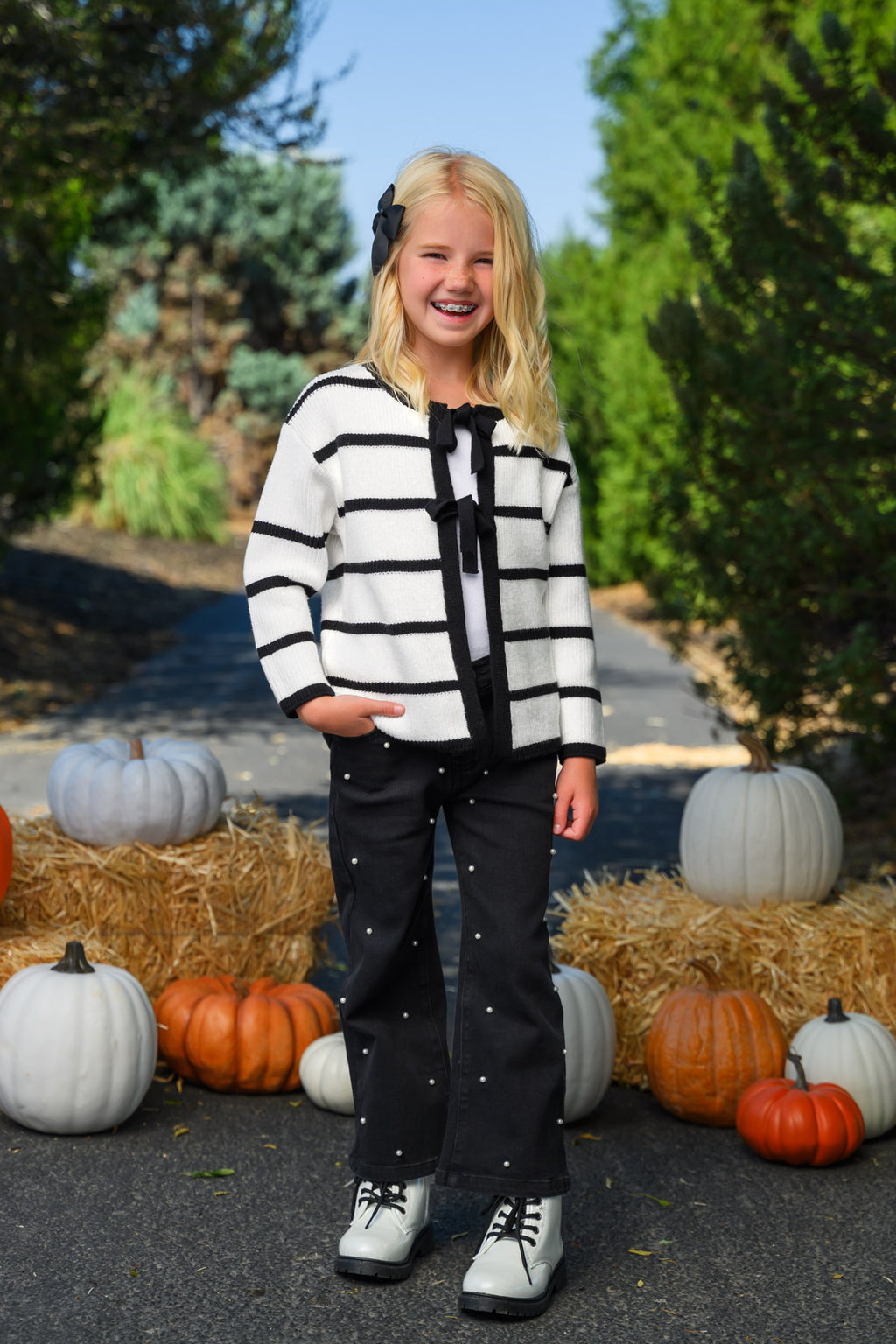 Striped Sweater Cardigan Denim Pant Set - 6-12 Months - Black and white striped cardigan with black tie detail, paired with black denim pants and sneakers.