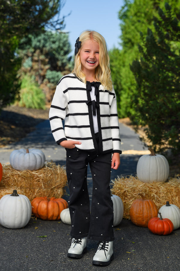 Striped Sweater Cardigan Denim Pant Set - 6-12 Months - Black and white striped cardigan with black tie detail, paired with black denim pants and sneakers.
