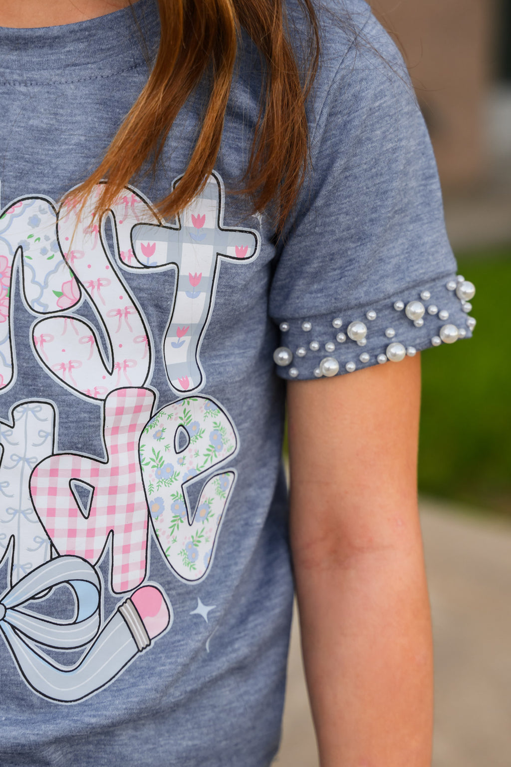 "Pre-K - Sixth Grade" Plaid Bow Denim Short Set - PRE-K / 2T - Blue short-sleeve shirt with colorful graphic text and pearl-embellished denim sleeves.