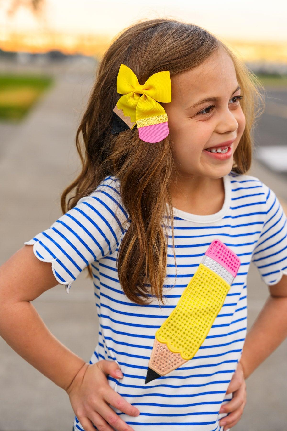 Rhinestone Pencil Denim Short Set - 3T - Blue and white striped short-sleeve shirt with a large yellow and pink rhinestone pencil graphic, worn by a smiling girl.