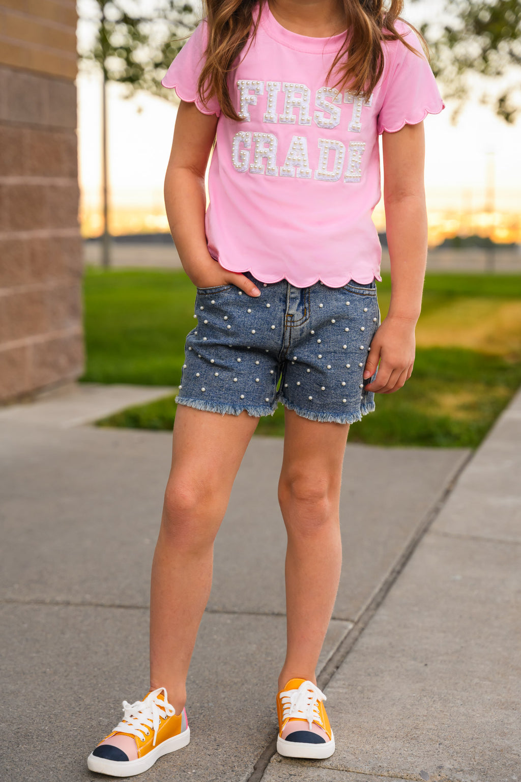 "Pre-K - Sixth Grade" Pink Pearl Denim Short Set - PRE-K / 2T - Pink cotton T-shirt with scalloped hem and "First Grade" text paired with blue denim shorts featuring white polka dots and.