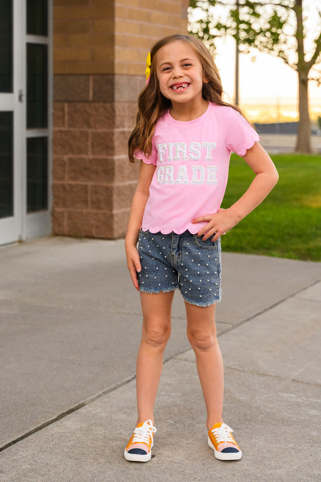 "Pre-K - Sixth Grade" Pink Pearl Denim Short Set - PRE-K / 2T - Pink short-sleeve T-shirt with white "First Grade" text paired with blue denim shorts featuring white polka dots and rolled.