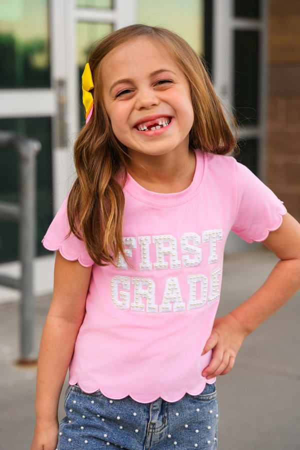 "Pre-K - Sixth Grade" Pink Pearl Denim Short Set - PRE-K / 2T - Pink cotton short-sleeve shirt with scalloped edges and "FIRST GRADE" white text on front.