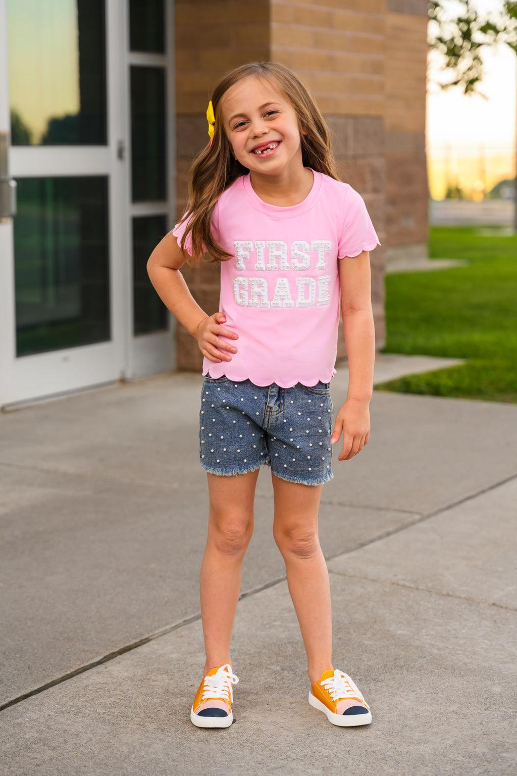 "Pre-K - Sixth Grade" Pink Pearl Denim Short Set - PRE-K / 2T - Pink short-sleeve cotton shirt with "FIRST GRADE" text paired with blue denim shorts featuring small white patterns.