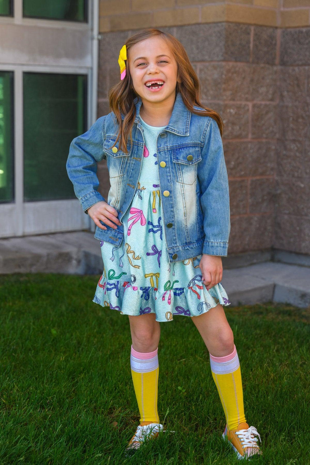 Mint Glitter School Bows Dress - 3T - Mint green dress with glitter bow patterns, ruffled hem, paired with denim jacket and knee-high yellow socks.