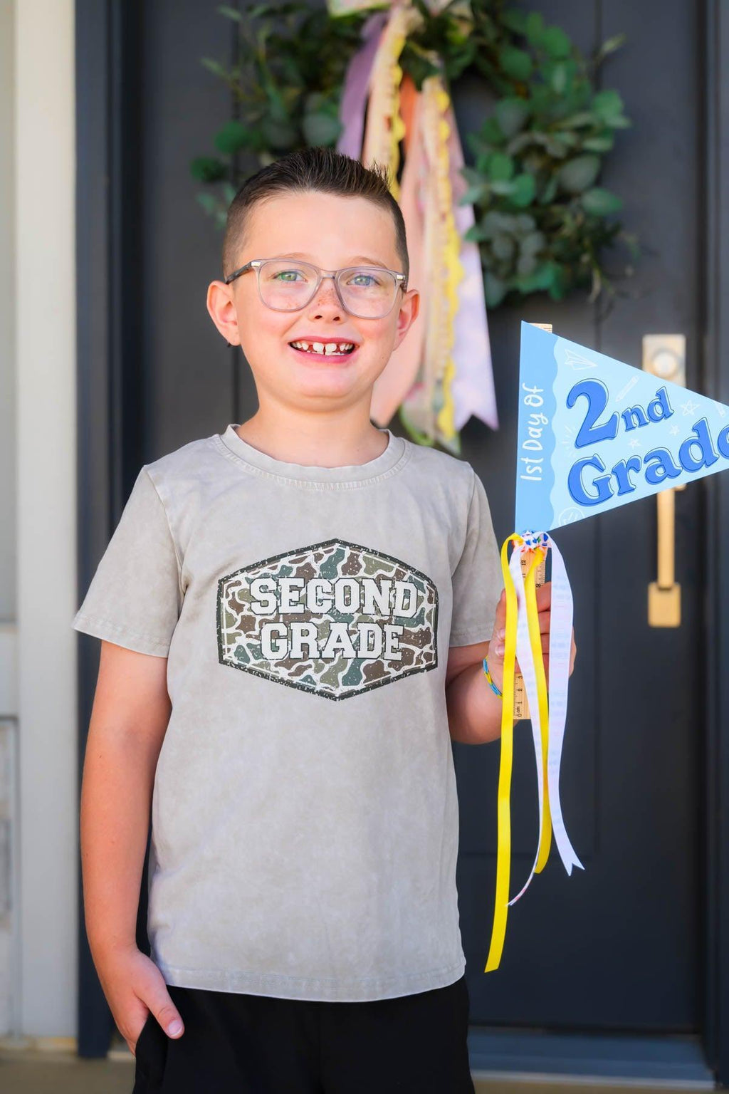 "Pre-K - Sixth Grade" Gray Camo Top - PRE-K / 2T - Gray camo short-sleeve top with "Second Grade" hexagon design worn by boy with glasses.