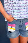 "Pre-K - Sixth Grade" Notebook Denim Short Set - PRE-K / 2T - Denim shorts with colorful geometric patch pockets and cuffed hems on child wearing white shirt with blue and pink text.