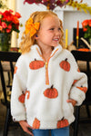 Mom & Me - Pumpkin Sherpa Pullover - CHILD-6-12 Months - Cream sherpa pullover with orange pumpkin prints, orange zipper, and matching ribbed trim, modeled by a child.