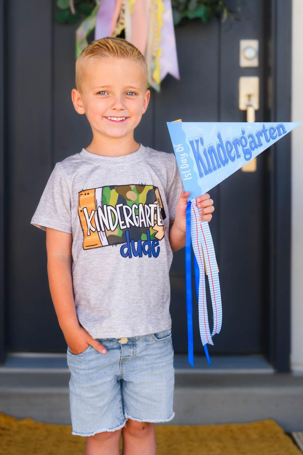 "Preschool - 5th Grade Dude" Camo Pencil Top - PRESCHOOL / 2T - Gray short-sleeve cotton t-shirt with colorful "Kindergarten dude" text and green camo pattern on the front.
