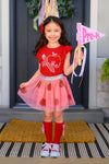 "Pre-K - 4th Grade" Pink Apple Tutu Skirt Set - PRE-K / 2T - Pink tulle tutu skirt with red apple accents paired with red top and knee-high socks on girl holding pink Pre-K flag.