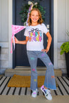 "Pre-K - Sixth Grade" Bow Denim Pant Set - PRE-K / 2T - Girl wearing gray denim pants with colorful bow patches and a white graphic t-shirt standing in front of a door.