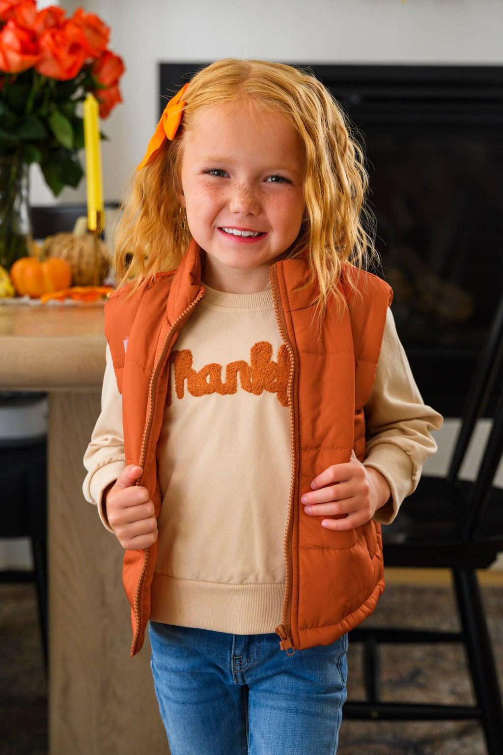 Mom & Me - "Thankful" Vest Set - CHILD-6-12 Months - Child wearing a rust-orange quilted vest over a tan “Thankful” sweatshirt and blue jeans.