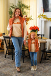 Mom & Me - "Thankful" Vest Set - CHILD-6-12 Months - Matching tan “Thankful” tops with orange plaid vests, worn by a woman and child with blue jeans.