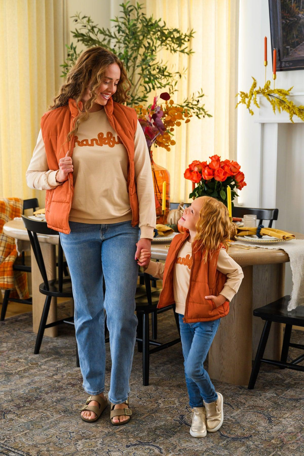 Mom & Me - "Thankful" Vest Set - CHILD-6-12 Months - Matching tan “Thankful” vests with orange trim worn by a mother and child, paired with jeans.