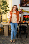 Mom & Me - "Thankful" Vest Set - CHILD-6-12 Months - Woman wearing an orange “thankful” vest over a tan top with blue jeans and sandals.