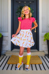 Pink Sequin Pencil Skirt Set - 2T - Girl wearing bright pink short-sleeve top with small embellishments and white skirt with colorful pencil print, paired with.