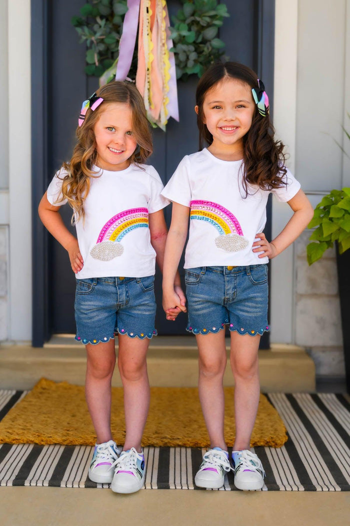 Gemstone Rainbow Denim Short Set - Left Side / 6-12 Months - Girls wearing white t-shirts with rainbow graphic and blue denim shorts with gemstone details.
