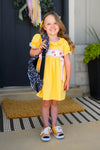 Yellow Pencil & Bows Dress - 3T - Yellow short-sleeve dress with pencil and bow print on the chest, ruffled sleeves, and a gathered waist.