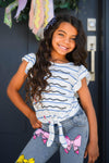 Notebook Bow Flare Denim Pant Set - 3T - Girl wearing white and navy striped flutter sleeve top with front tie and light wash denim pants with pink bow appliqués on.