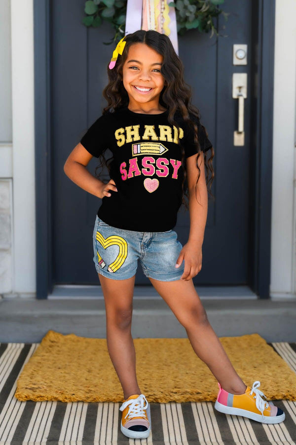 "Sharp & Sassy" Denim Short Set - Small-3T - Black short-sleeve t-shirt with "Sharp & Sassy" text paired with light blue denim shorts featuring heart patches.