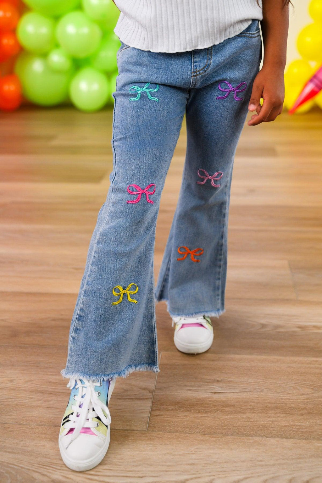 "Pre-K - Sixth Grade" Bow Denim Pant Set - PRE-K / 2T - Light blue denim pants with colorful embroidered bows scattered on front legs and frayed hems.