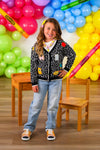Mom & Me - Composition Sweater Cardigan - CHILD-3T - Black knitted cardigan with colorful patches, button-up front, worn with light blue jeans and white sneakers.