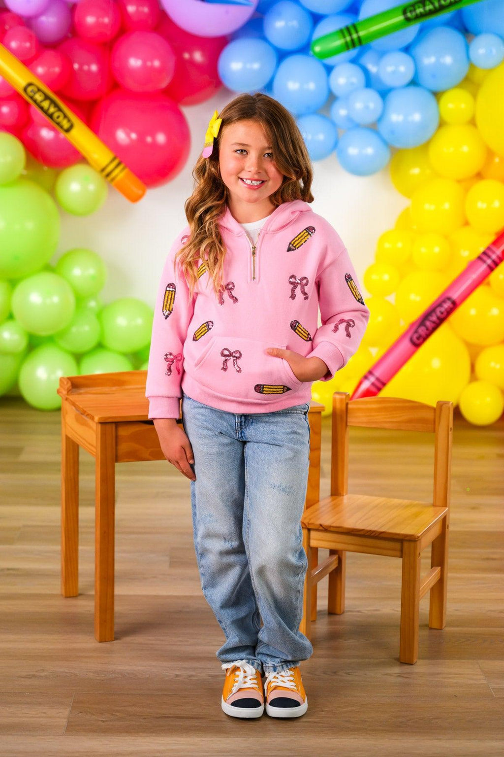 Mom & Me - Pink Pencils & Bows Pullover - 3T - Light pink pullover with colorful pencils and bow prints, worn with blue jeans and sneakers.