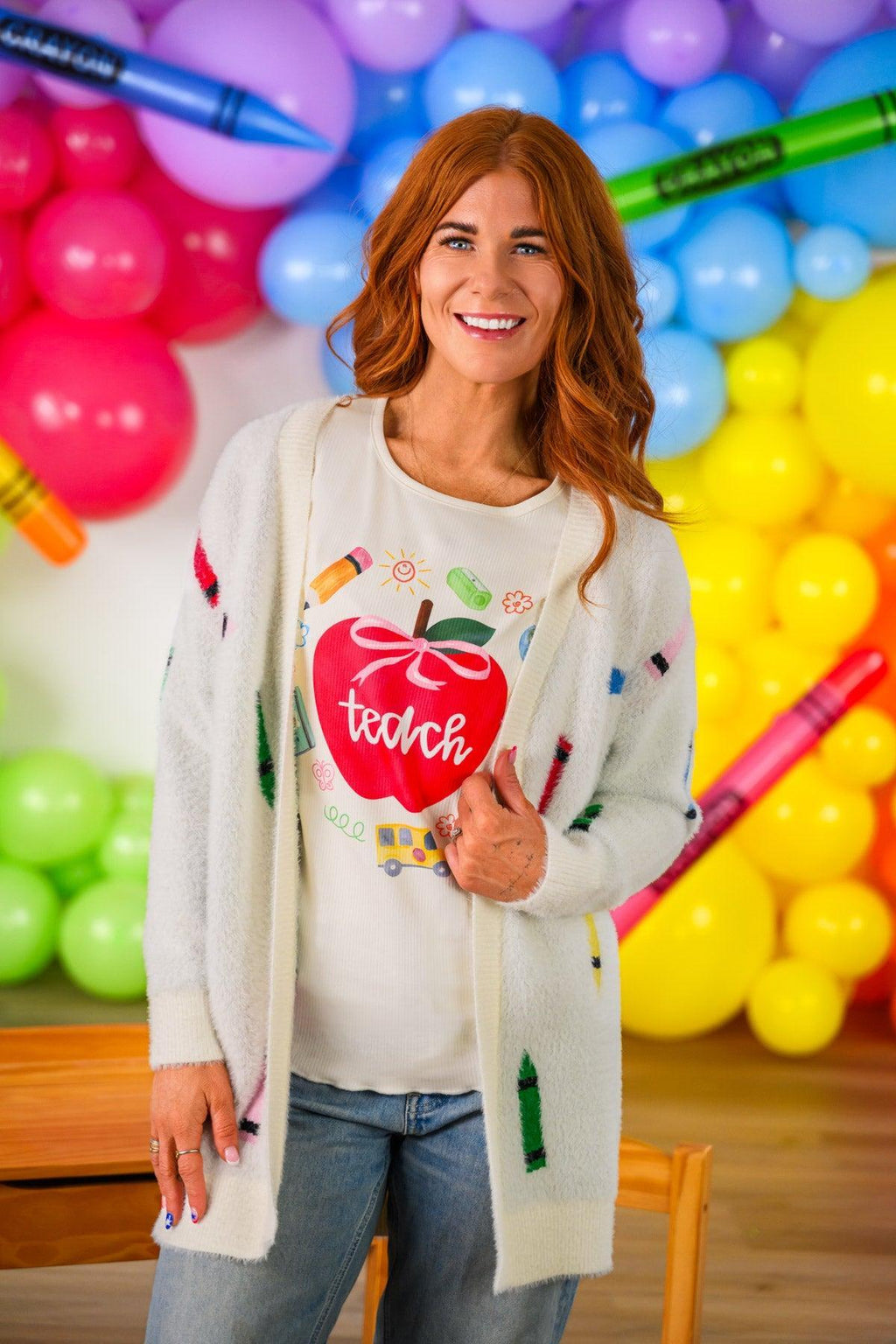 Mom & Me - Crayon Cardigan - CHILD-3T - Cream knit cardigan with colorful crayon embroidery worn over a white shirt featuring a red apple and the word "teach".