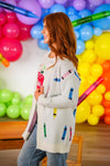 "Teach" Apple Top - MOM-XS - Cream-colored cardigan with colorful crayon-shaped embroidery, worn over a light top.