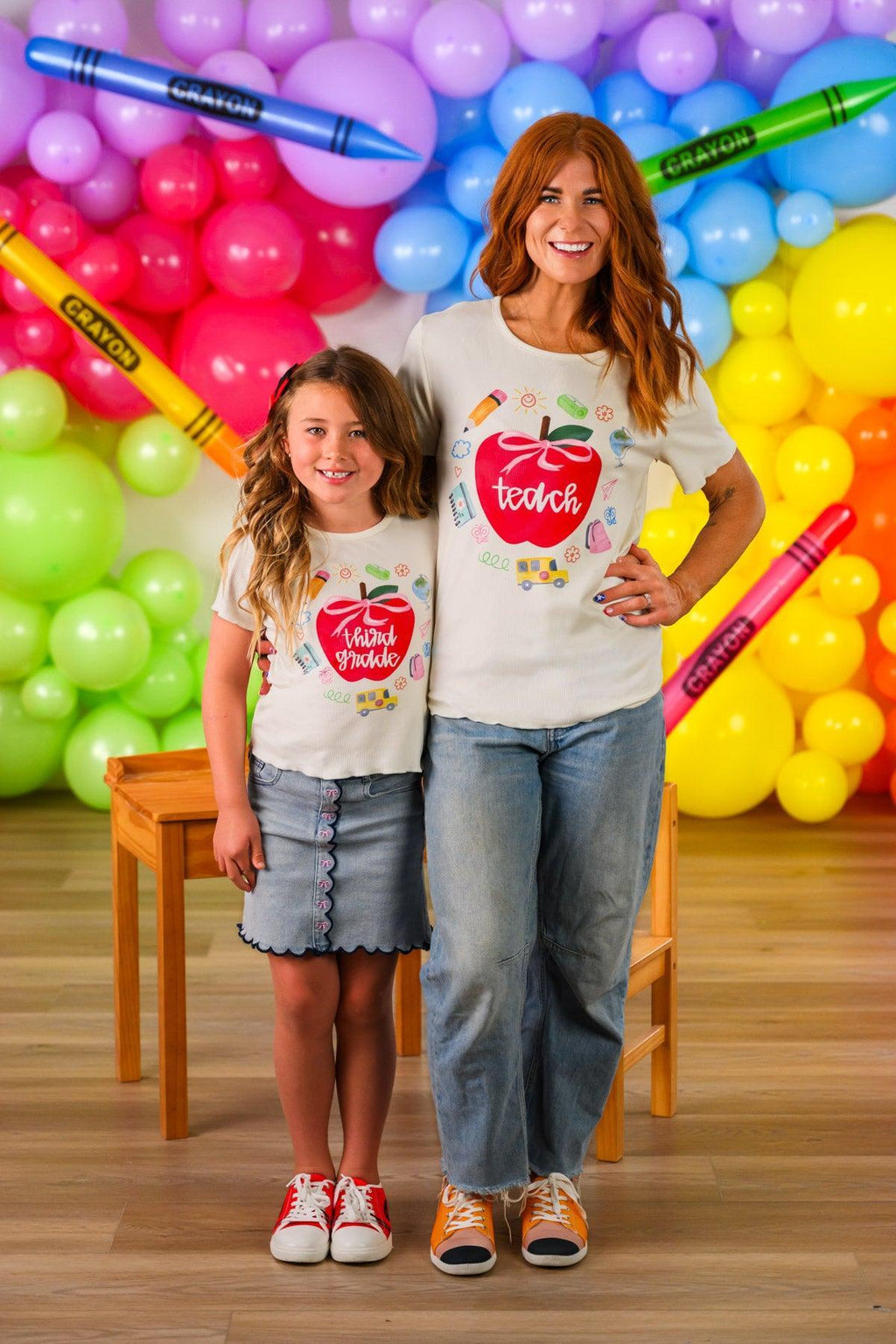 "Pre-K - Fifth Grade" Apple Denim Skirt Set - PRE-K / 2T - Cream short-sleeve t-shirts with red apple graphics paired with a light blue denim skirt and jeans.
